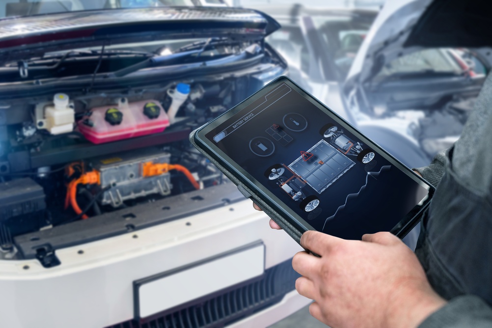Checking,The,Battery,Pack,Of,An,Electric,Car,At,A